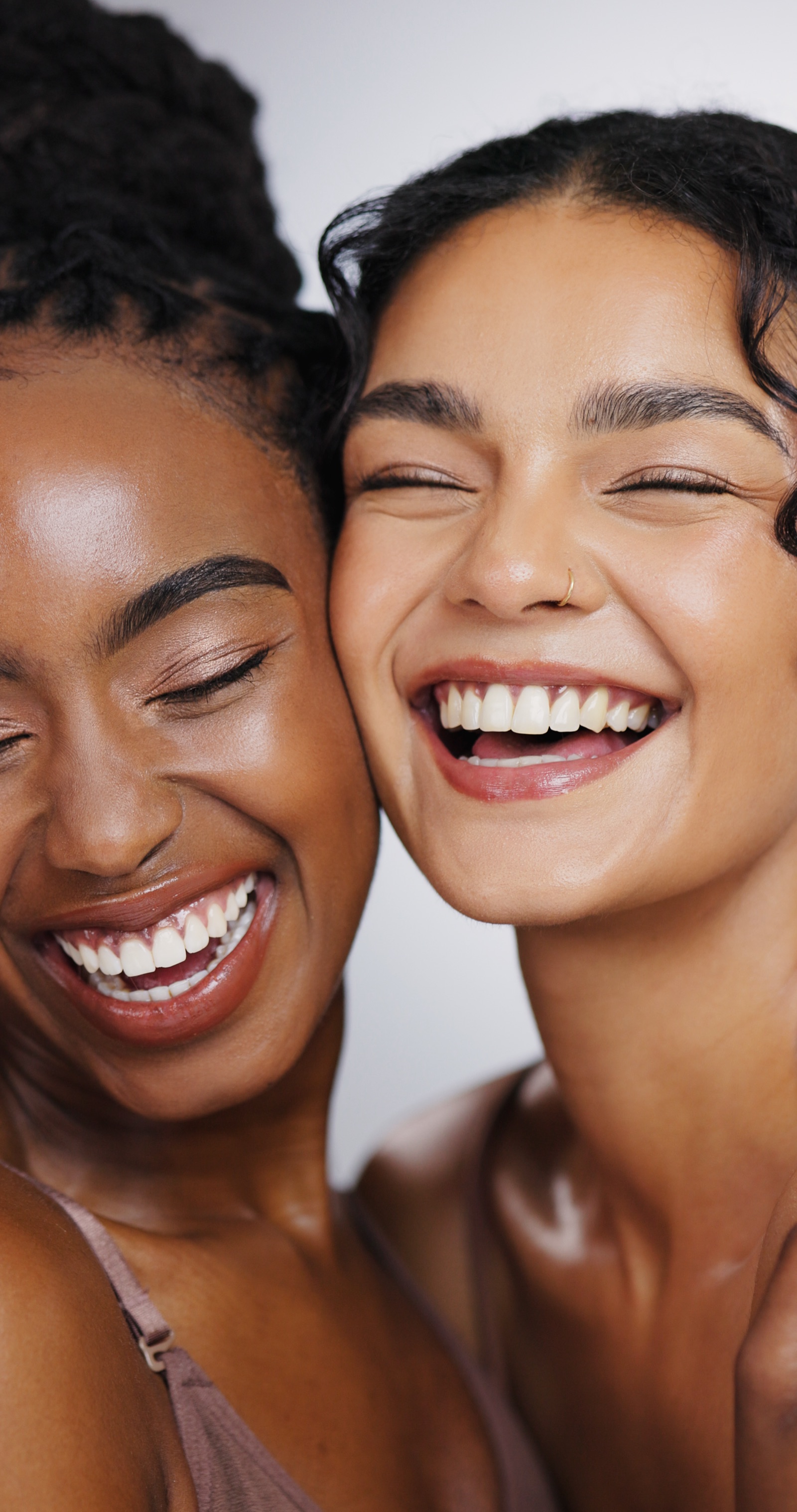 Two happy clients with glowing skin